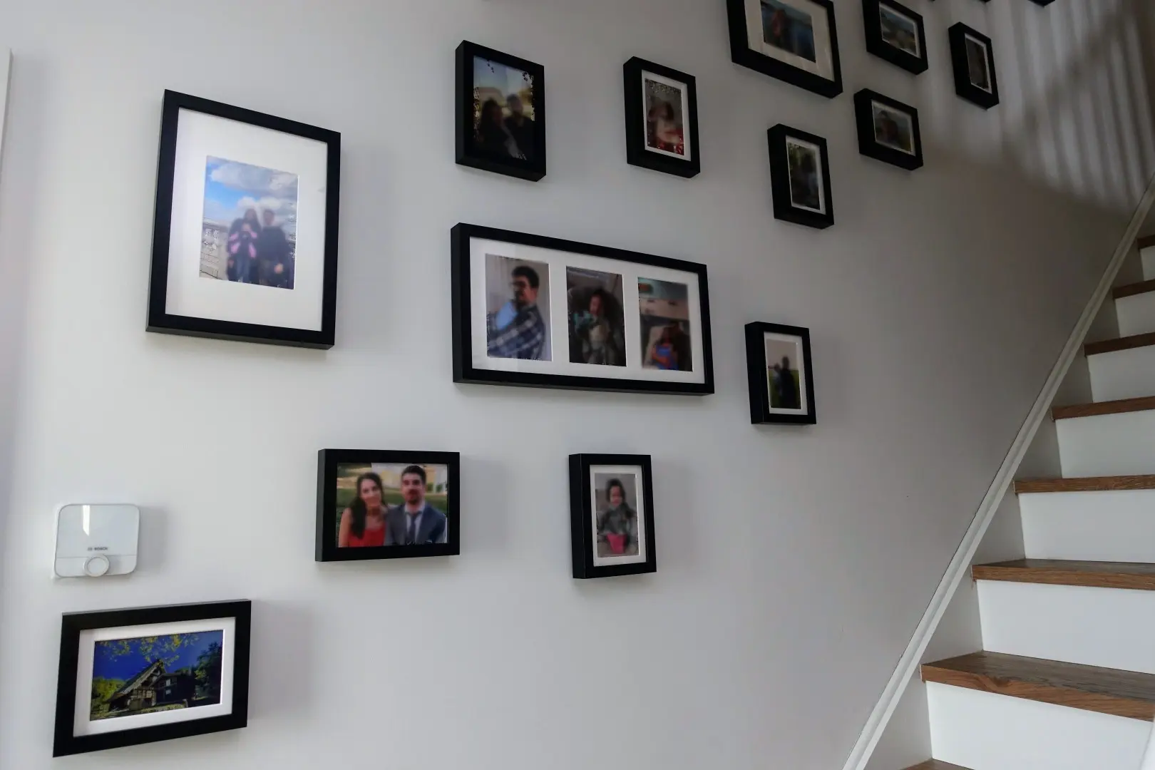 Spot the epaper. A photo being displayed in the epaper blends in really well with regular framed photo prints.